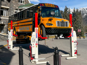 Stertil-Koni Mobile Columns lifting an electric school bus